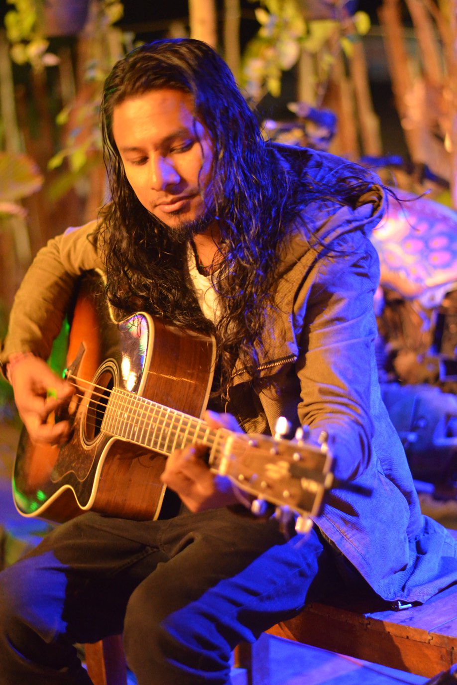 Pawan singing with Guitar